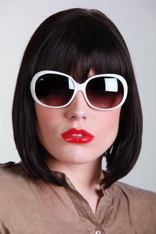 Portrait Of A Young Brunette With Sunglasses Royalty Free Stock Photography Portrait Of A Young Brunette With Sunglasses Royalty Free Stock Photography