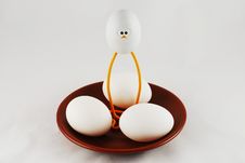 Eggs And A Toy Chicken Royalty Free Stock Photo