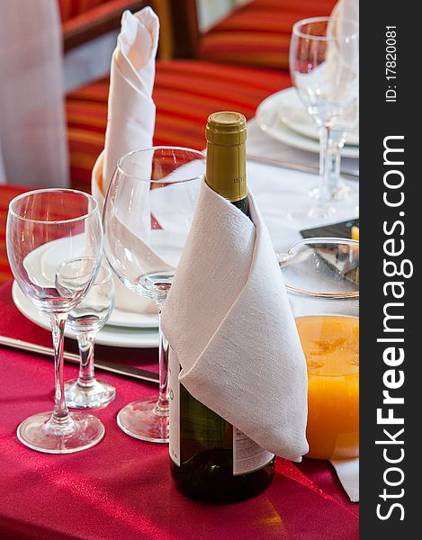 Wine bottle on a festive table during a banquet. Wine bottle on a festive table during a banquet.