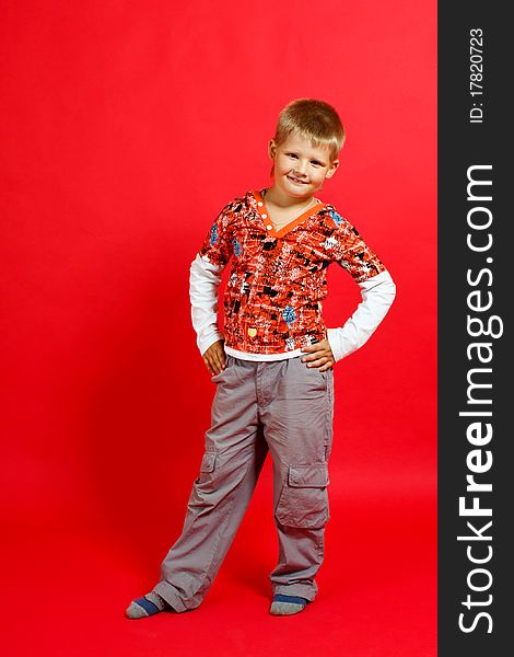 Little boy on a red background