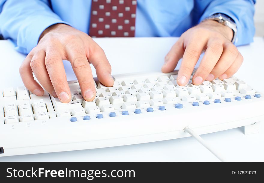 Male hands on a white keyboard. Male hands on a white keyboard