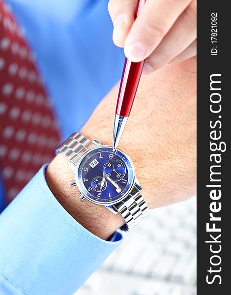 Businessman looking at the watch. Businessman looking at the watch