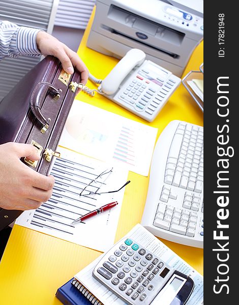 Businessman holding a brown case. Businessman holding a brown case