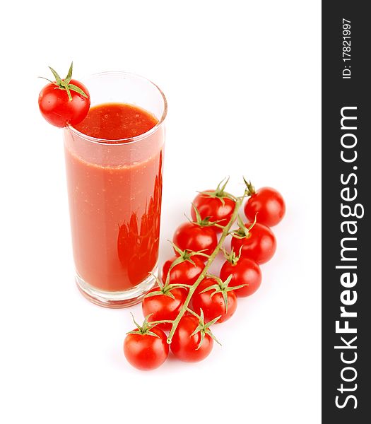 Fresh tomatoes and a glass full of tomato juice. Fresh tomatoes and a glass full of tomato juice