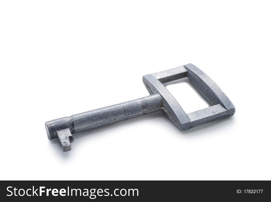 Old silver key isolated on a white background