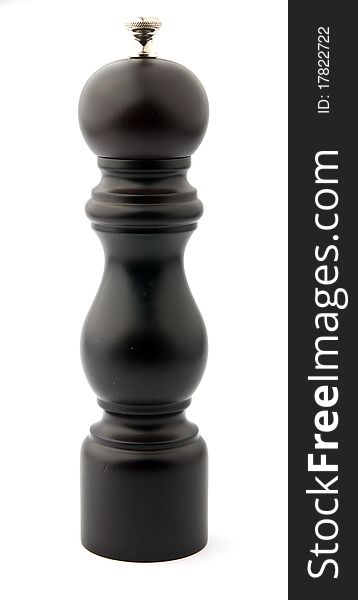 Brown wooden pepper mill isolated over white background