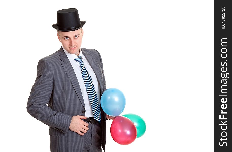 Businessman in a black hat with inflatable colored balls