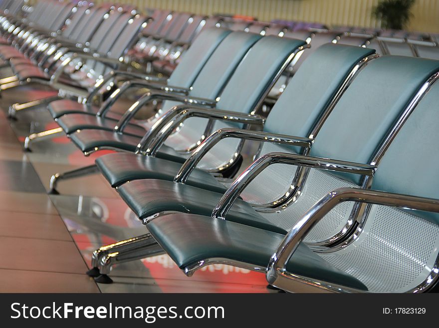 Chairs lined at the departure/arrival hall of an airport in Kuala Lumpur, Malaysia. Chairs lined at the departure/arrival hall of an airport in Kuala Lumpur, Malaysia