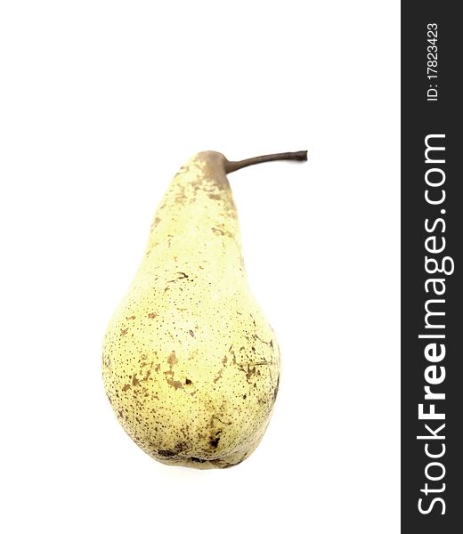 A yellow pear on a white background