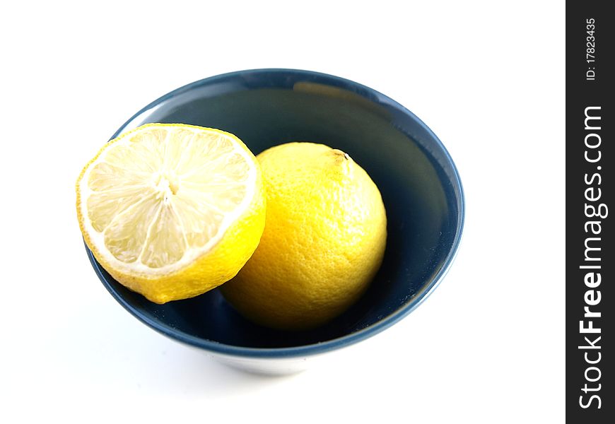 Lemon in a bowl on a white background