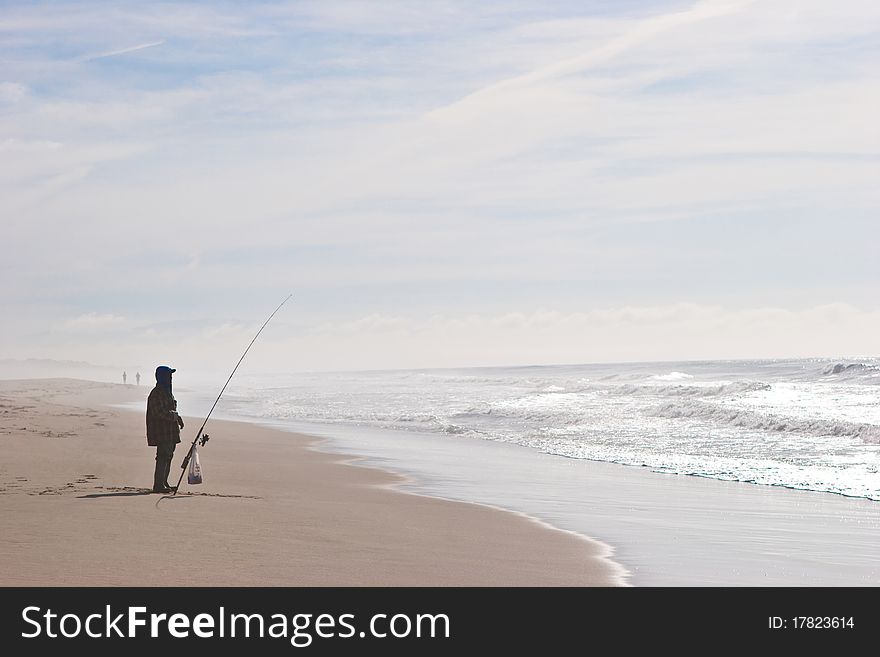 Fisherman at the shore of the pacific ocean. Fisherman at the shore of the pacific ocean