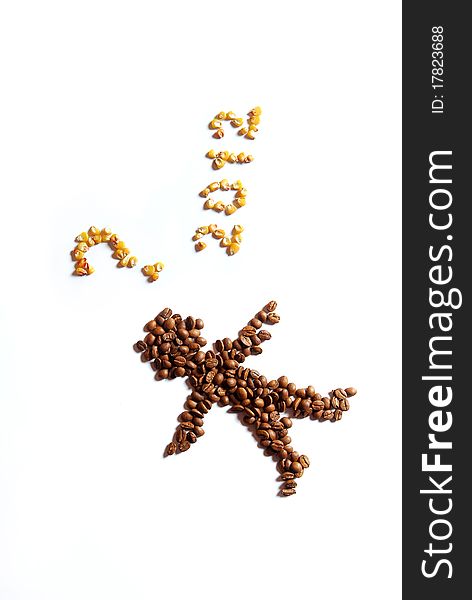 Man arranged from coffee beans, question mark and figures arranged from corn. Man arranged from coffee beans, question mark and figures arranged from corn