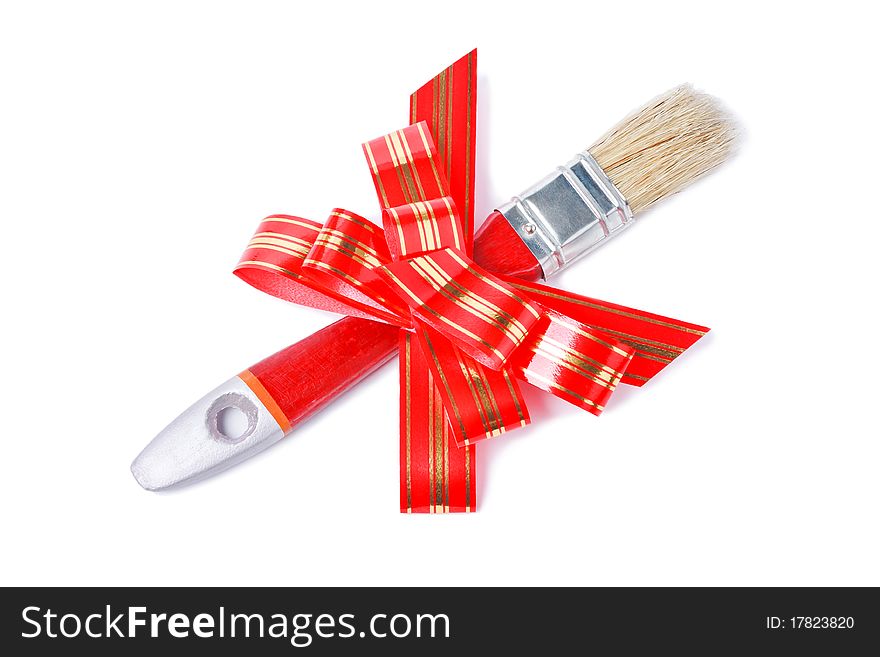 Paintbrush with red goldish striped bow as a gift for painter isolated on white background. Paintbrush with red goldish striped bow as a gift for painter isolated on white background
