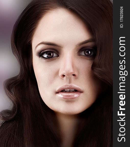 Beauty studio portrait of young sensual woman, professional make up and hair style.