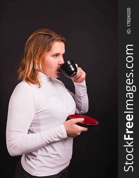 Businesswoman with cup of coffee (isolated on black)