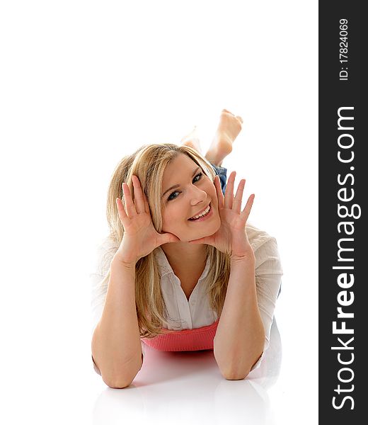 Young casual smiling woman lying on the floor isolated on white background