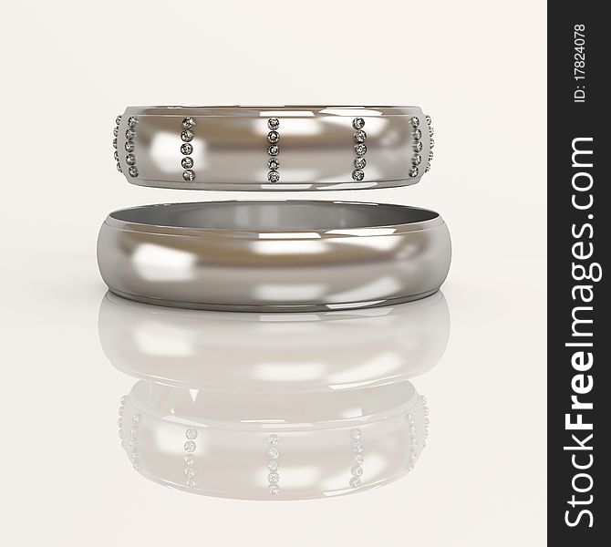 Wedding rings with brilliants on a white background
