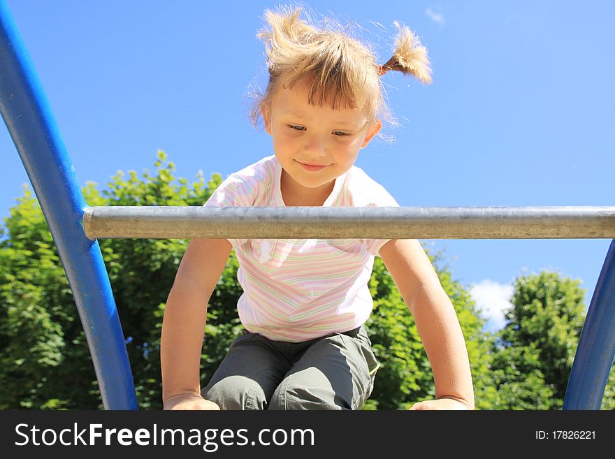 A child enters the ladder on the playground