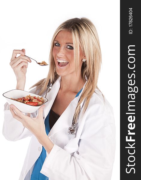 A woman doctor is eating a bowl of cereal. A woman doctor is eating a bowl of cereal.