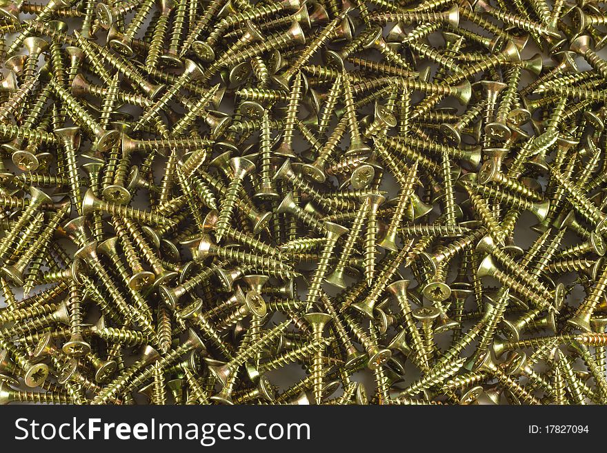 A lot of screws from yellow metal