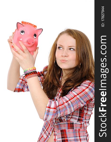 Young beautiful woman standing with piggy bank (money box), isolated on white background. Young beautiful woman standing with piggy bank (money box), isolated on white background