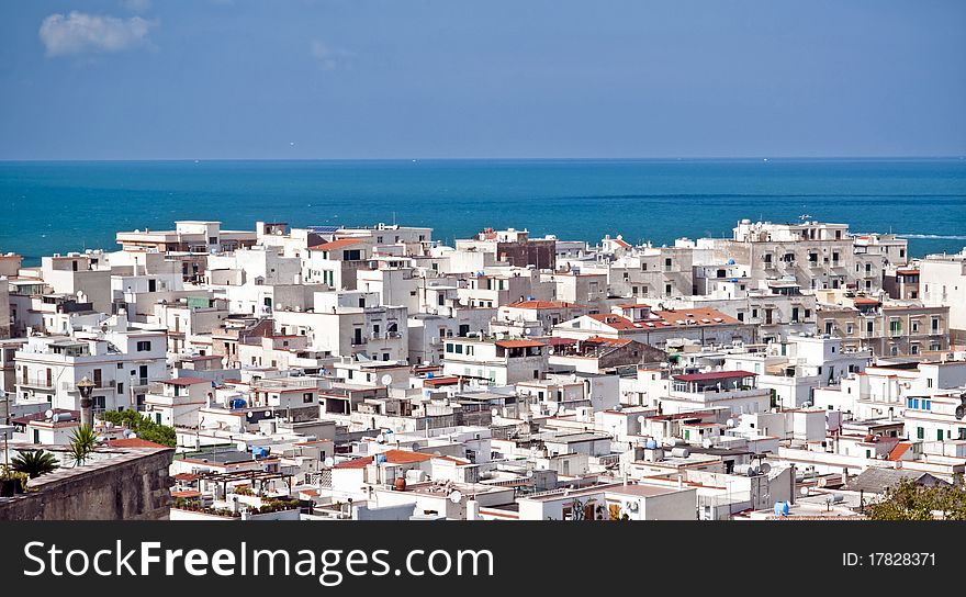 The mediterranean city with the sea in a sunny day from the hill