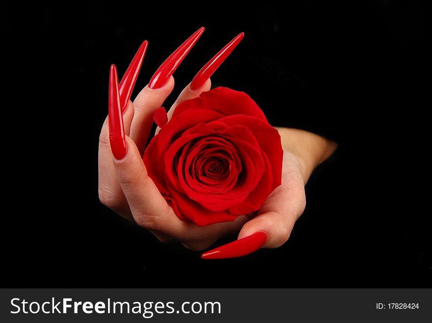 Human fingers with long fingernail and beautiful manicure isolated on black