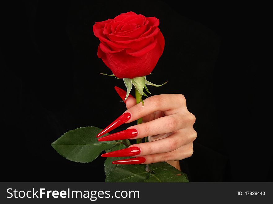 Human fingers with long fingernail and beautiful manicure isolated on black