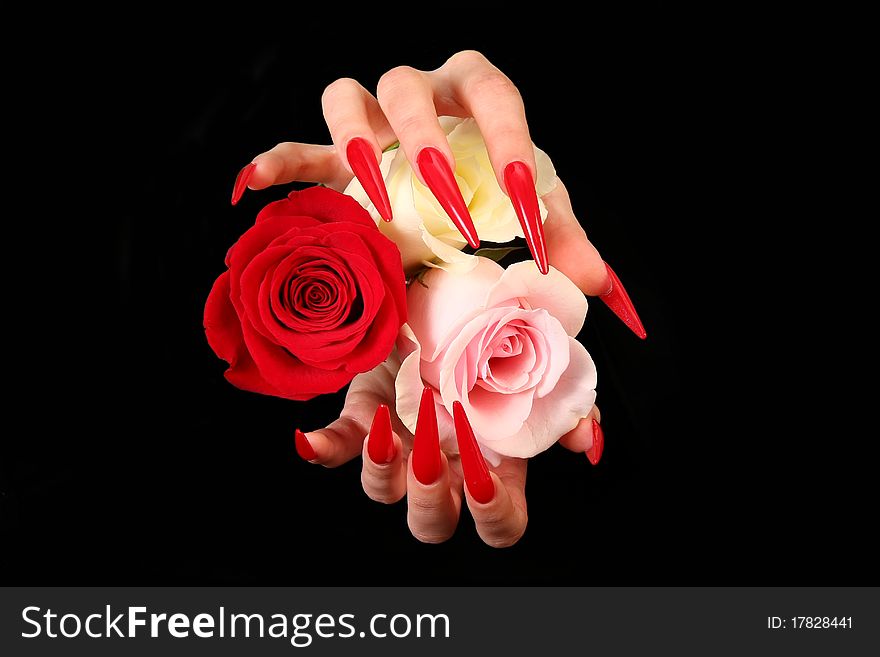 Human fingers with long fingernail and beautiful manicure isolated on black