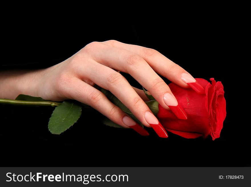 Human fingers with long fingernail and beautiful manicure isolated on black