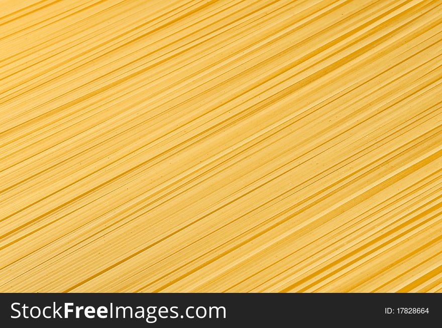 Uncooked spaghetti close-up as a decorative background