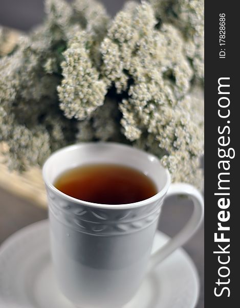 Cup of healing tea and yarrow flowers. Cup of healing tea and yarrow flowers