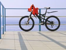 Alone Bicycle At The Seafront Fence In Sunny Day Stock Photo Alone Bicycle At The Seafront Fence In Sunny Day Stock Photo