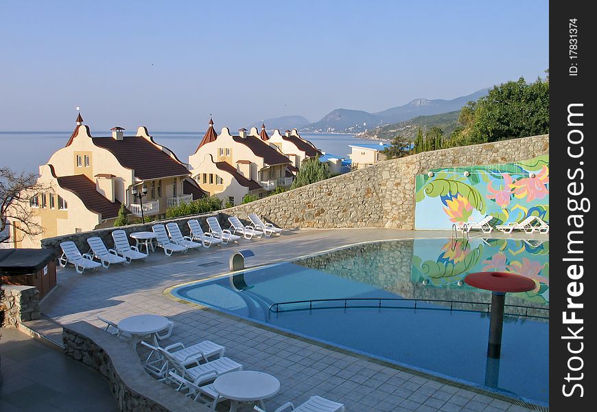 Mansions with tiled roof and swimming pool at Black Sea shore in Crimea Ukraine. Mansions with tiled roof and swimming pool at Black Sea shore in Crimea Ukraine