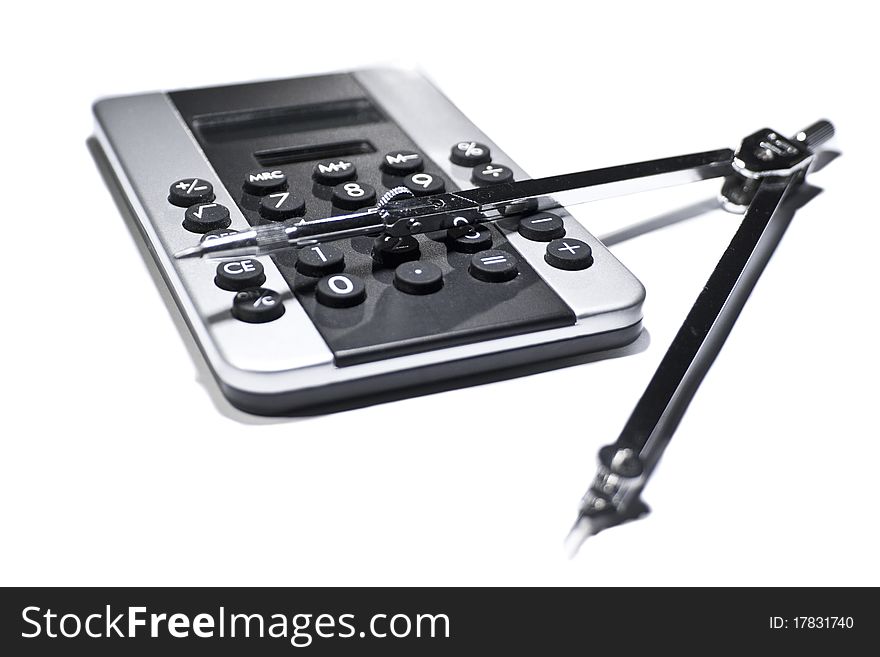 Silver black pocket calculator and chrome circle isolated on white background. Silver black pocket calculator and chrome circle isolated on white background