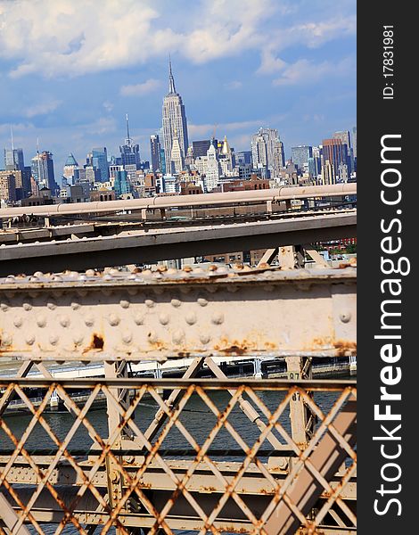 New York skyline seen from bridge over the Hudson under a blue and slightly cloudy sky. New York skyline seen from bridge over the Hudson under a blue and slightly cloudy sky.