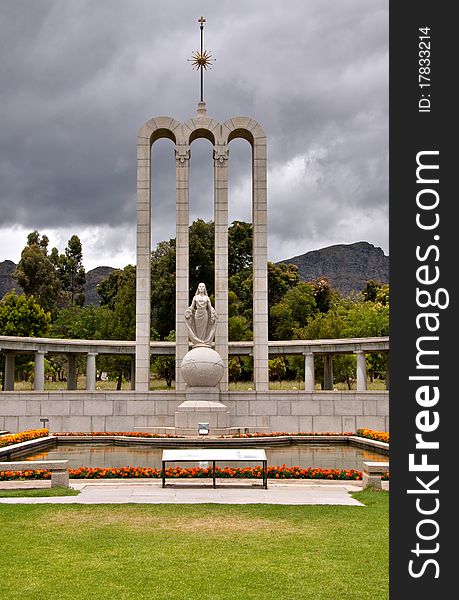 The Huguenot Monument in summer with green grass and blooming gardens in Franschhoek, Western Cape, South Africa. The Huguenot Monument in summer with green grass and blooming gardens in Franschhoek, Western Cape, South Africa