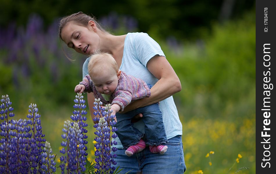 Mother & Daughter in Field of Lupine Flowers