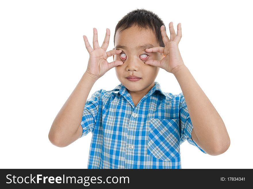 Boy making his pupils disappear, isolated on white background. Boy making his pupils disappear, isolated on white background