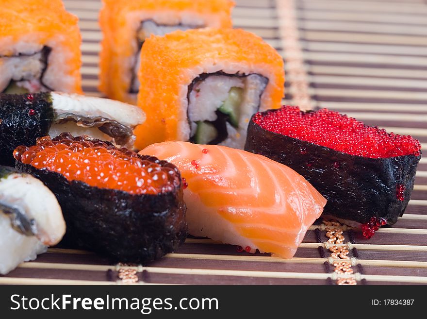 Traditional japanese sushi and rolls close up