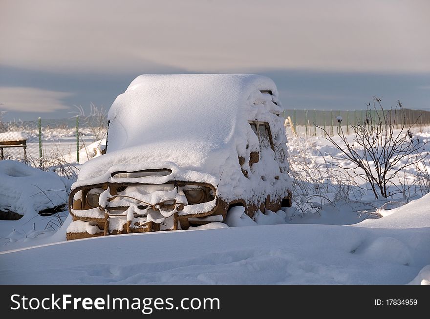 The car brought by snow costs in a snowdrift. The car brought by snow costs in a snowdrift