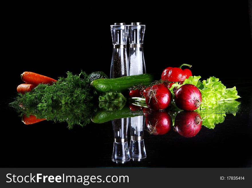 Fresh and wet vegetables on black background. Fresh and wet vegetables on black background