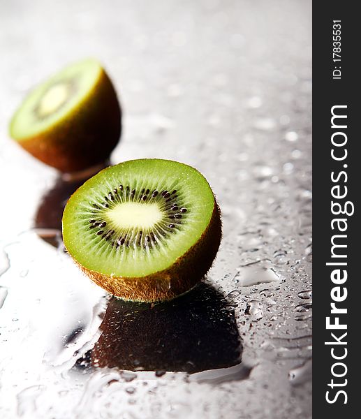 Fresh and wet kiwi with reflection. Fresh and wet kiwi with reflection