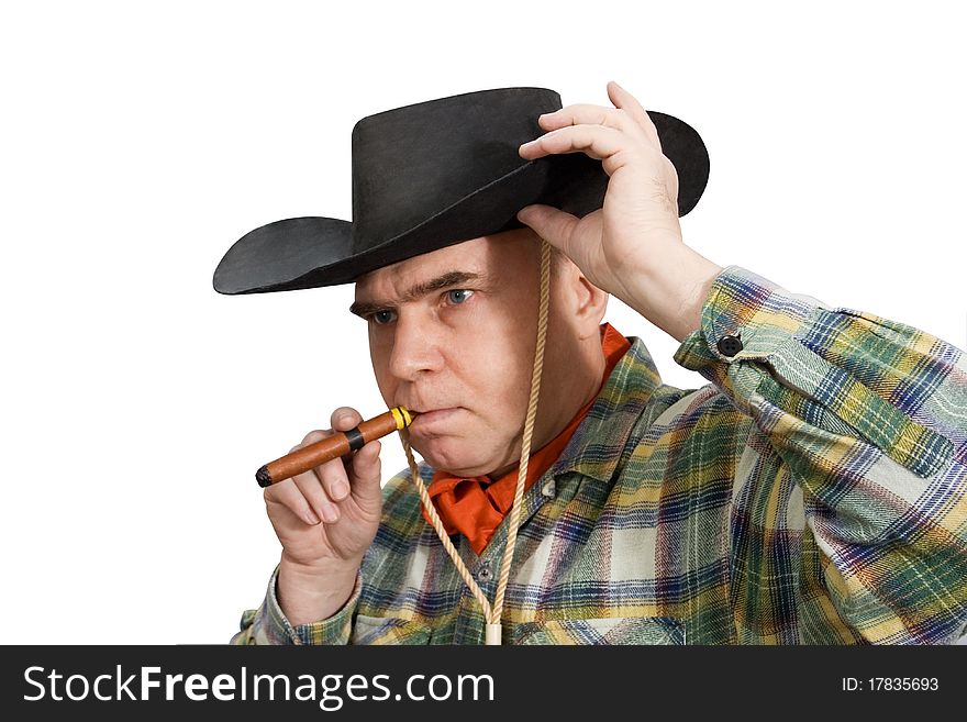 One man in cowboy dress and hat. Shooting in the studio. One man in cowboy dress and hat. Shooting in the studio.