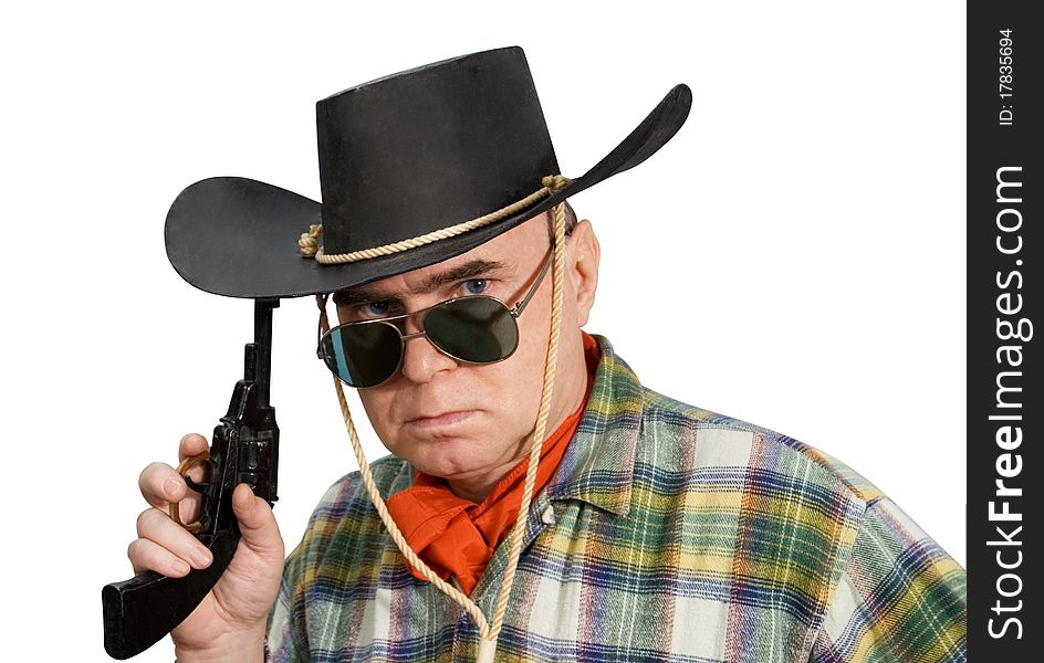 One man in cowboy dress and hat. Shooting in the studio. One man in cowboy dress and hat. Shooting in the studio.