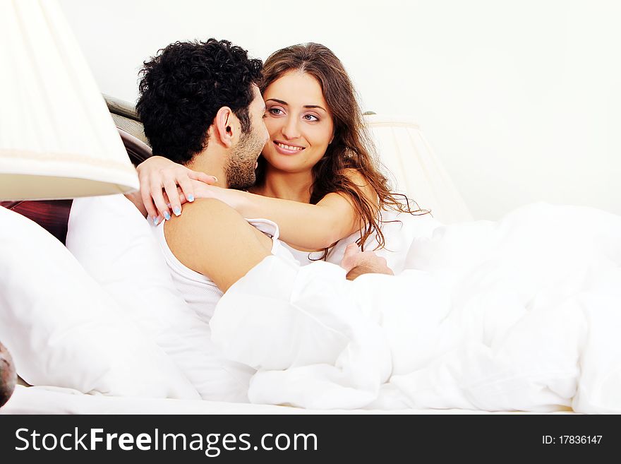 Young Couple In Bed