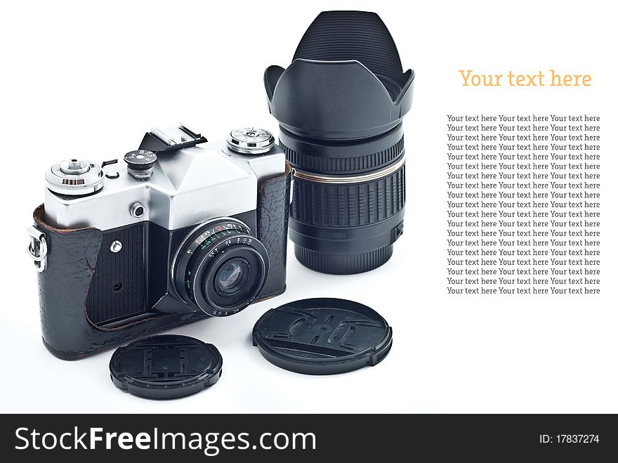 Black retro slr camera with lens. Isolated on white