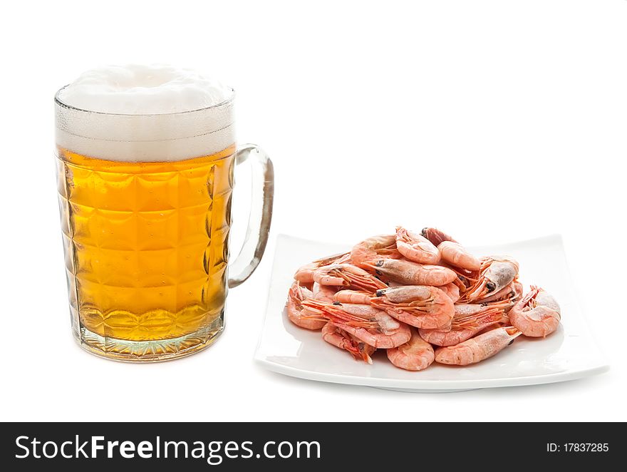 Fresh, cold beer in glass and fried shrimps on plate. Isolated on white. Fresh, cold beer in glass and fried shrimps on plate. Isolated on white