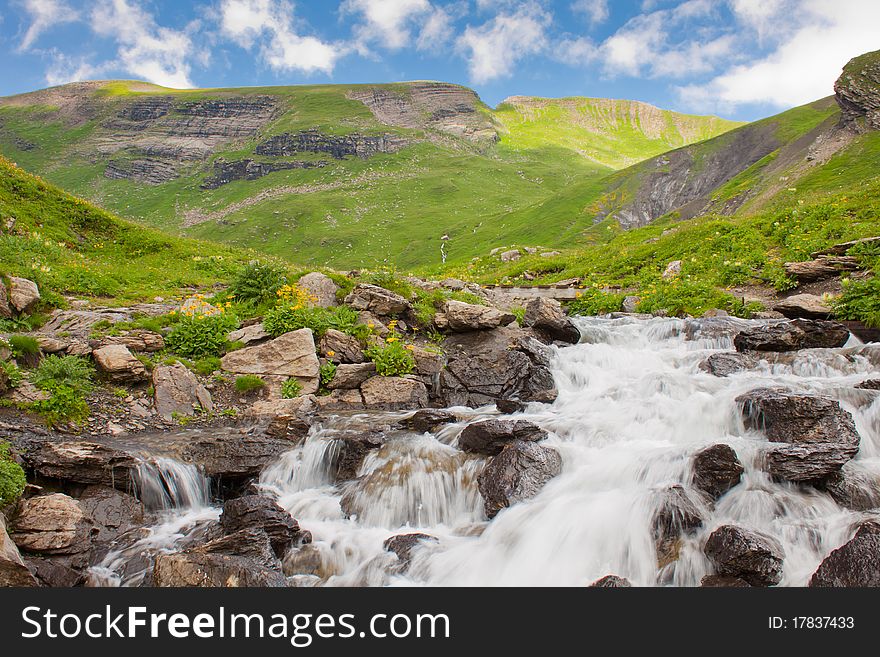 Waterfall in green alps mountains, near Grindelwald. Waterfall in green alps mountains, near Grindelwald