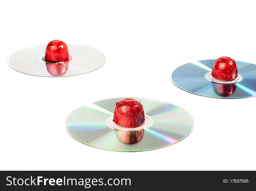Set of sweets placed on CDs. Isolated on white background. Set of sweets placed on CDs. Isolated on white background.